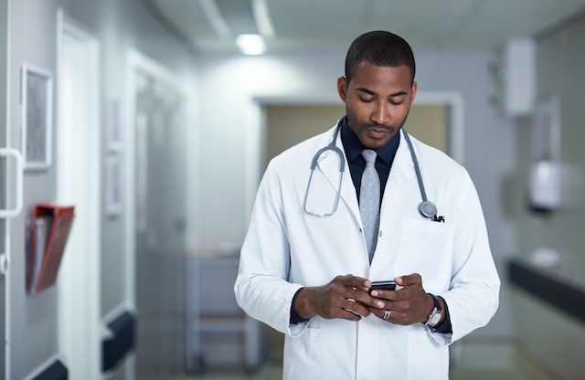 doctor looking at phone