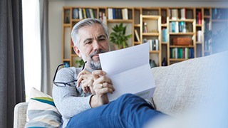 Patient reading a patient information sheet