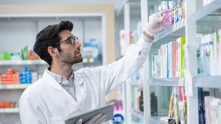 Pharmacist checking inventory