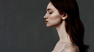 young woman with eyes closed